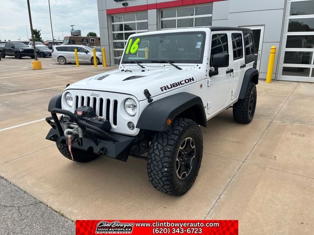 2016 Jeep Wrangler Unlimited Unlimited Rubicon in Bright White Clearcoat — front three-quarter view